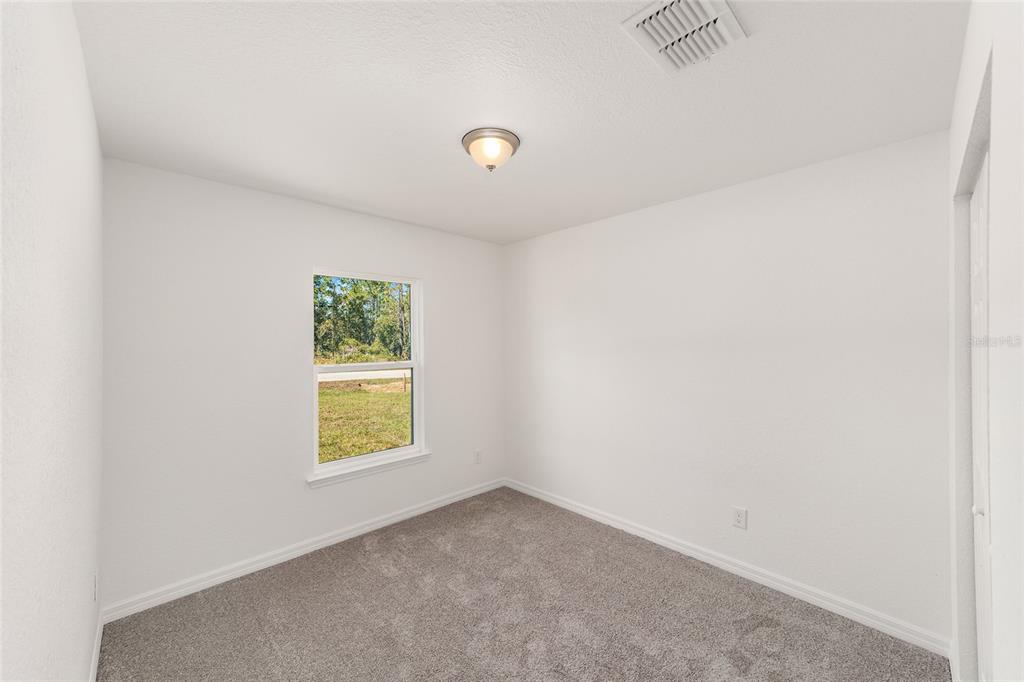 284 Southwest Commodore Road Dunnellon, FL 34431 - Photo 28 of 48 an empty room with windows