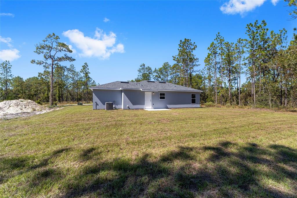 284 Southwest Commodore Road Dunnellon, FL 34431 - Photo 35 of 48 a view of a house with a yard