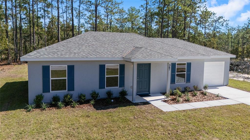 284 Southwest Commodore Road Dunnellon, FL 34431 - Photo 36 of 48 a view of a house with yard and sitting area