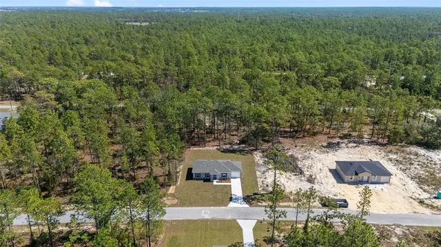 an aerial view of residential house with outdoor space