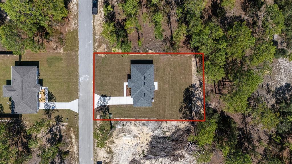 284 Southwest Commodore Road Dunnellon, FL 34431 - Photo 43 of 48 an aerial view of a house with a yard