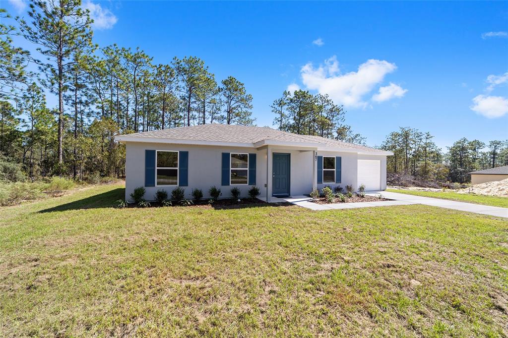 284 Southwest Commodore Road Dunnellon, FL 34431 - Photo 7 of 48 a view of house with outdoor space and swimming pool