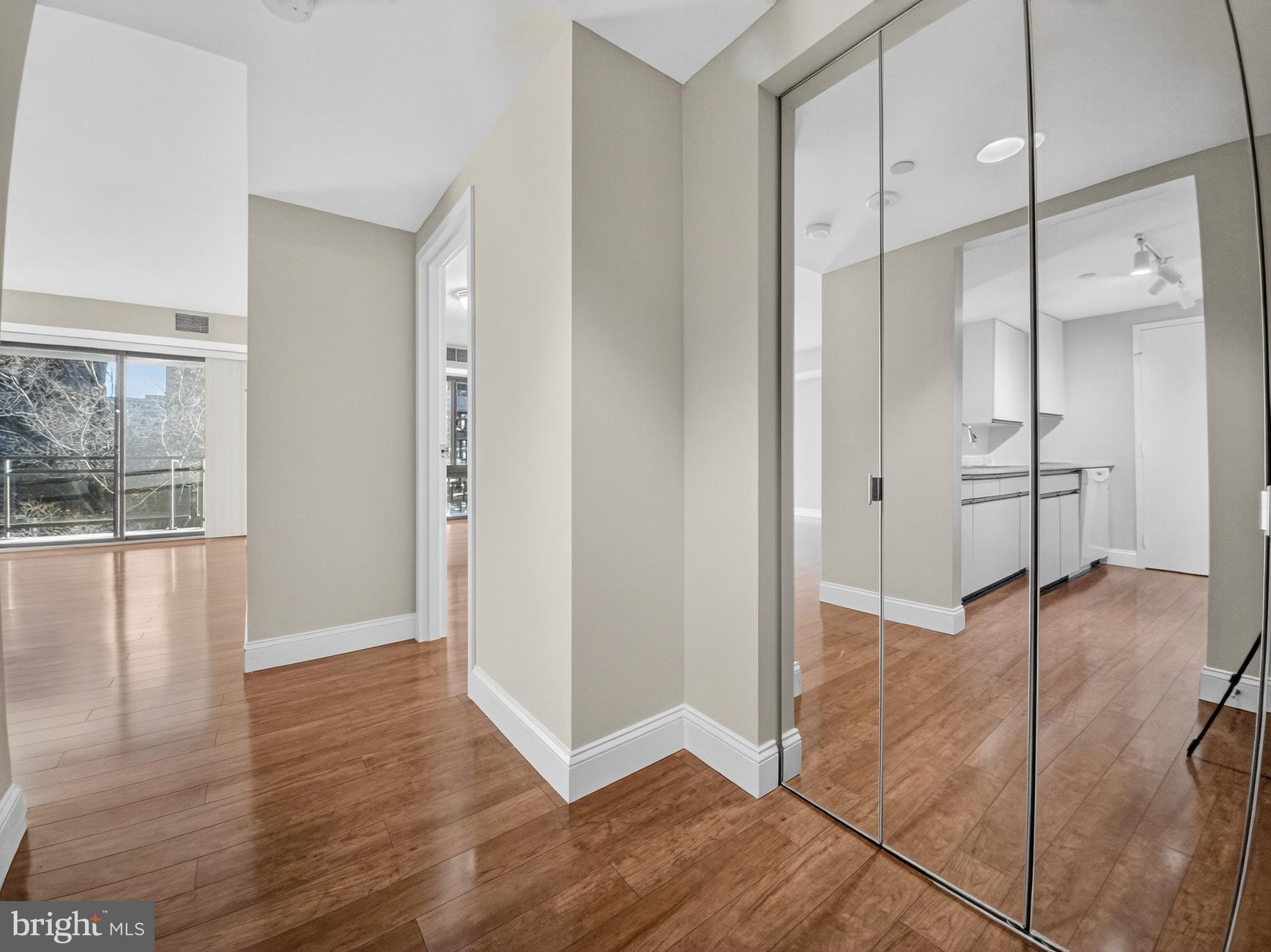 1530 Key Boulevard, Unit 517 Arlington, VA 22209 - Photo 12 of 50 a view of empty room with wooden floor and window