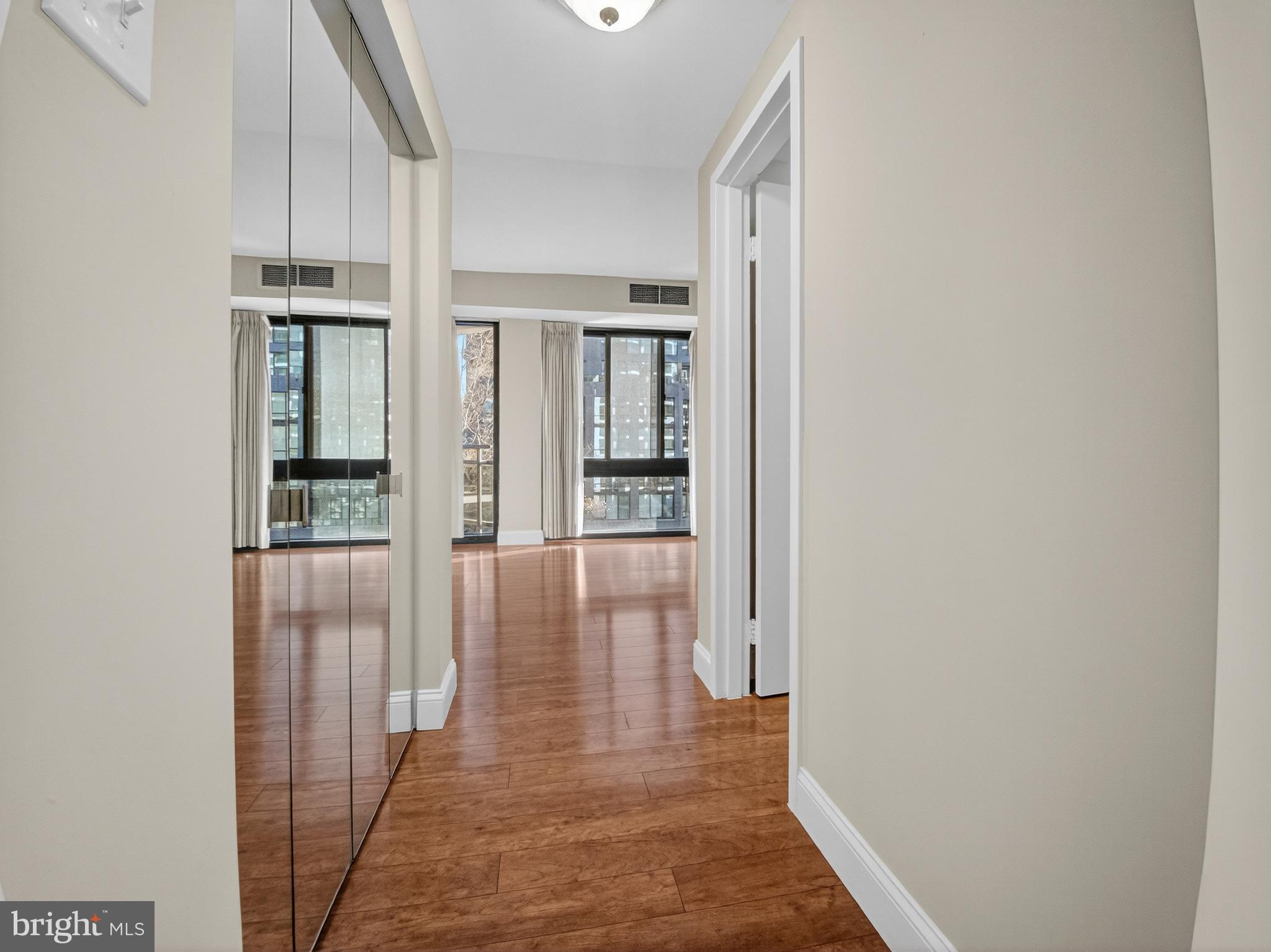 1530 Key Boulevard, Unit 517 Arlington, VA 22209 - Photo 13 of 50 a view of a hallway with wooden floor and staircase