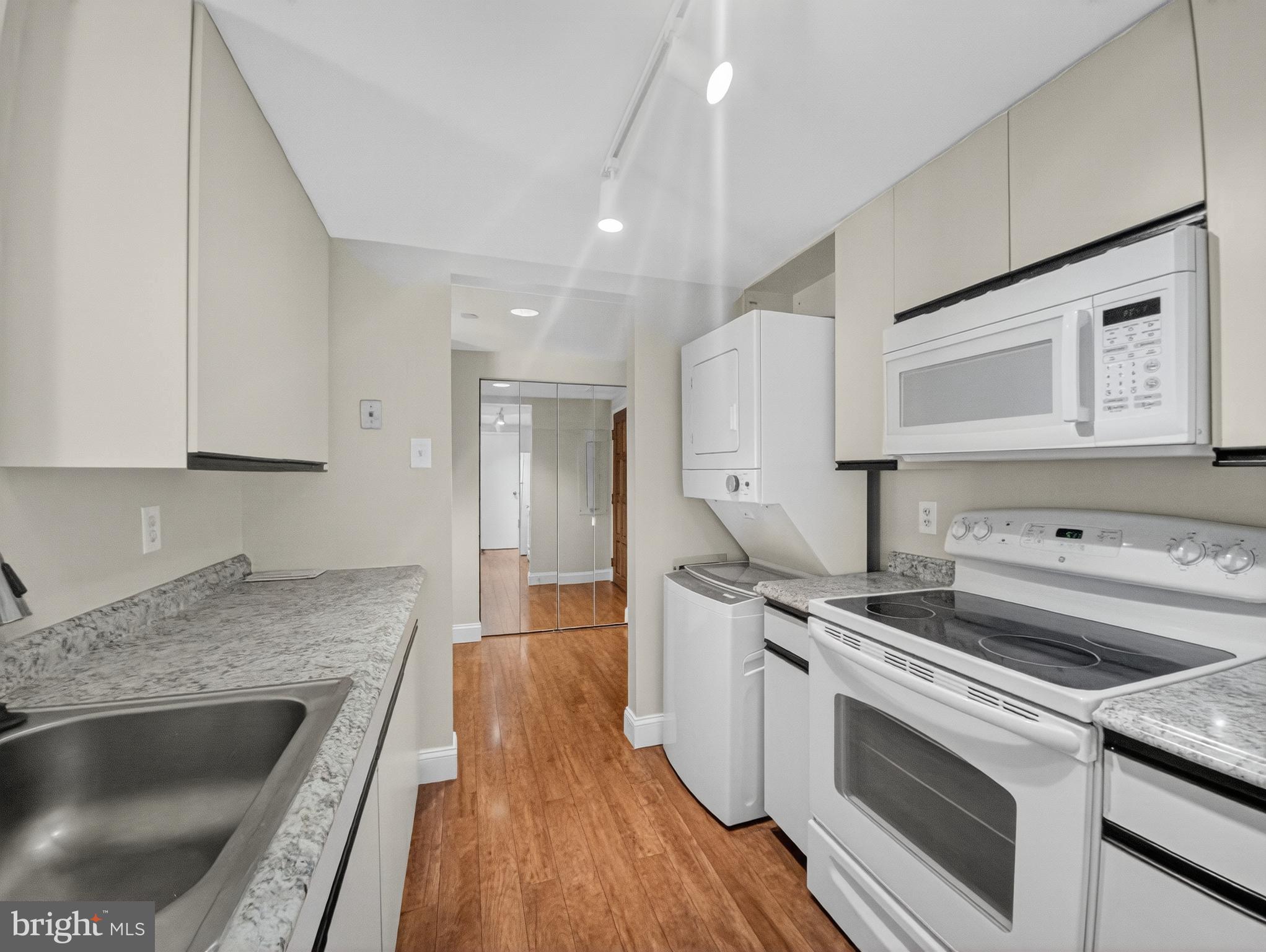 1530 Key Boulevard, Unit 517 Arlington, VA 22209 - Photo 22 of 50 a kitchen with a stove and a sink