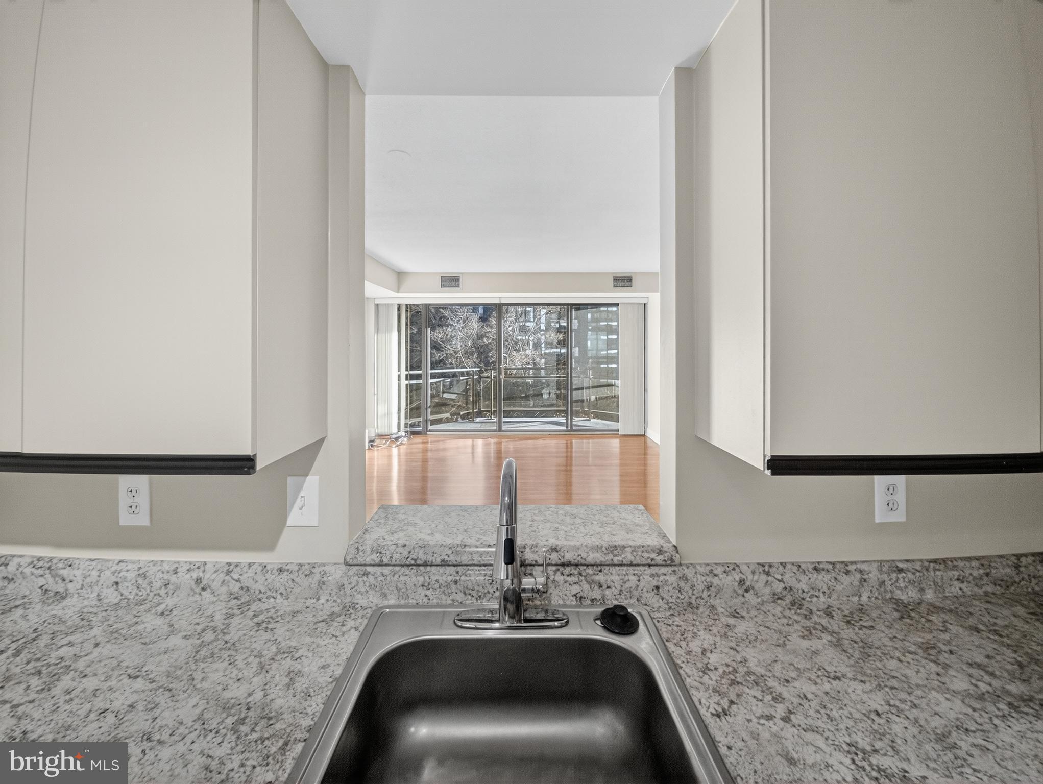 1530 Key Boulevard, Unit 517 Arlington, VA 22209 - Photo 23 of 50 a view of a granite counter top a sink and a window
