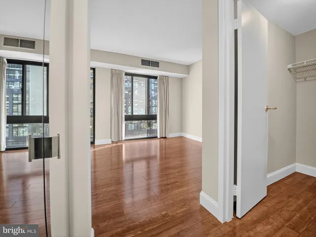 a view of room with wooden floor