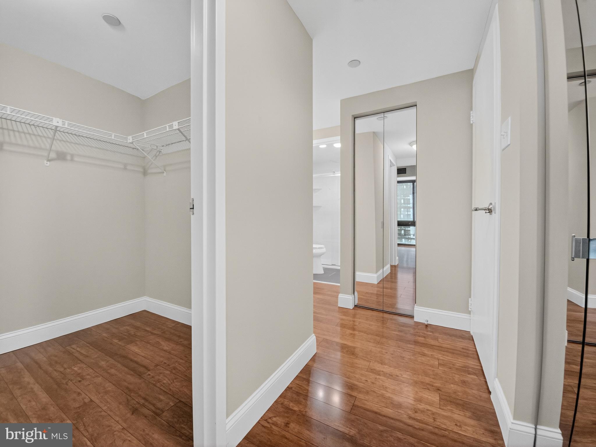 1530 Key Boulevard, Unit 517 Arlington, VA 22209 - Photo 31 of 50 a view of a room with wooden floor and a bathroom