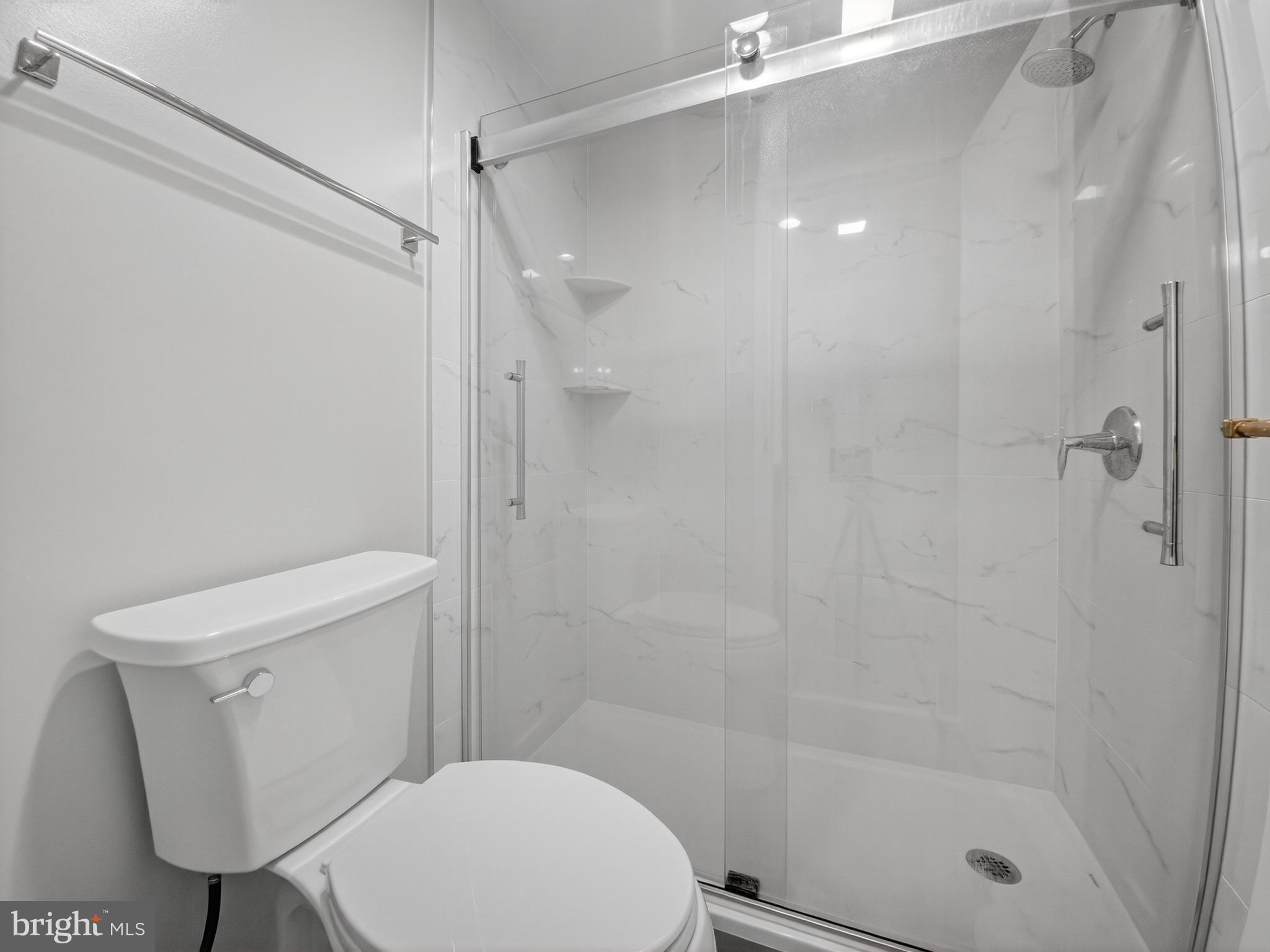 1530 Key Boulevard, Unit 517 Arlington, VA 22209 - Photo 33 of 50 a bathroom with a toilet and a shower