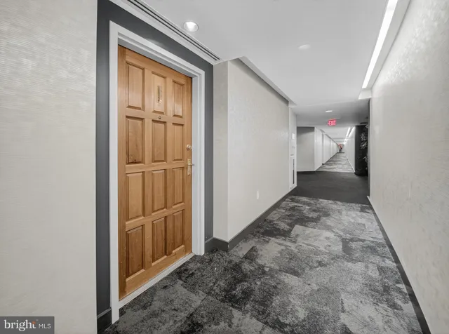 a living room with furniture and a rug