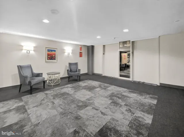 a view of a livingroom with furniture and a flat screen tv