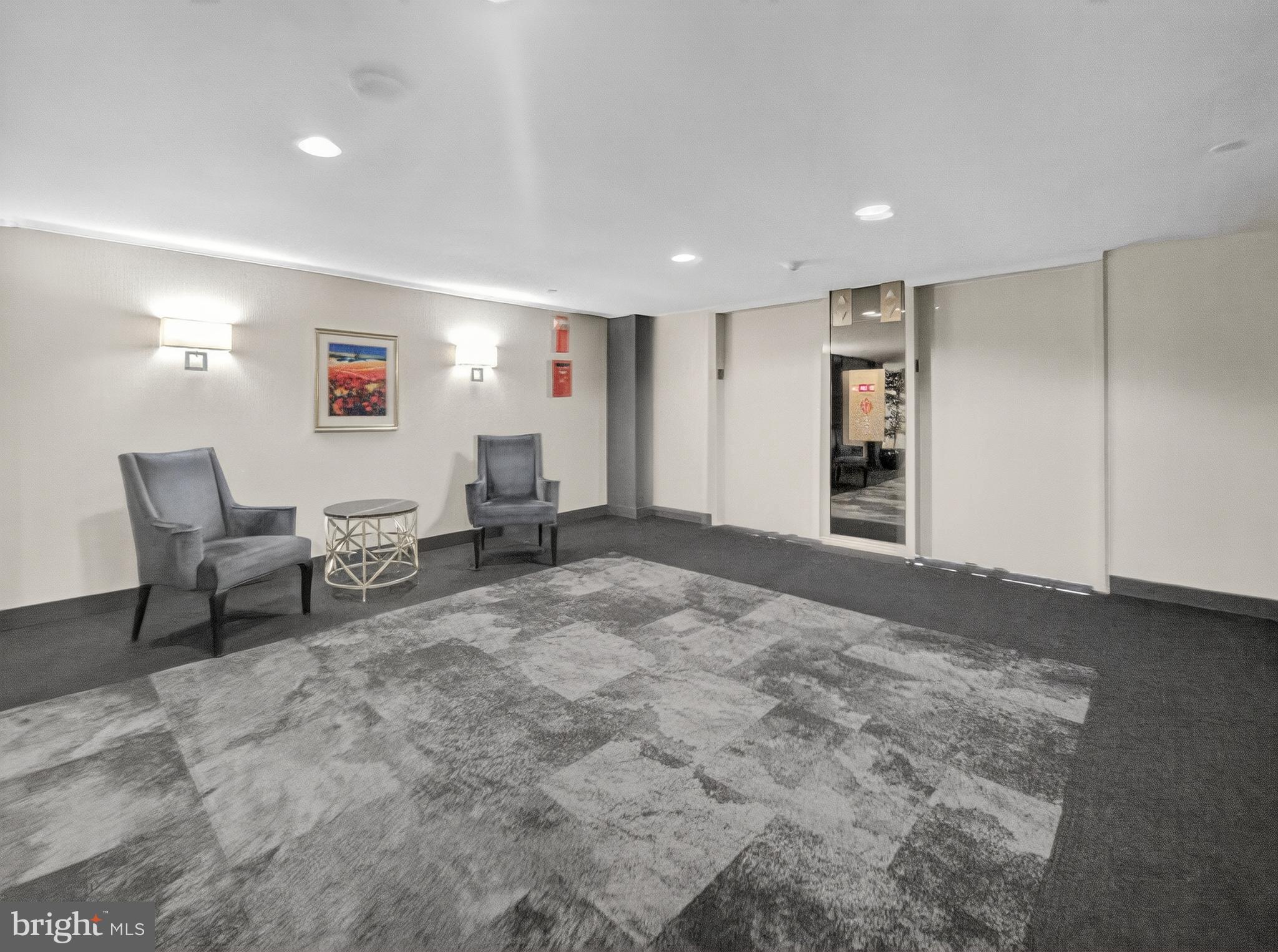 1530 Key Boulevard, Unit 517 Arlington, VA 22209 - Photo 35 of 50 a living room with furniture and a rug