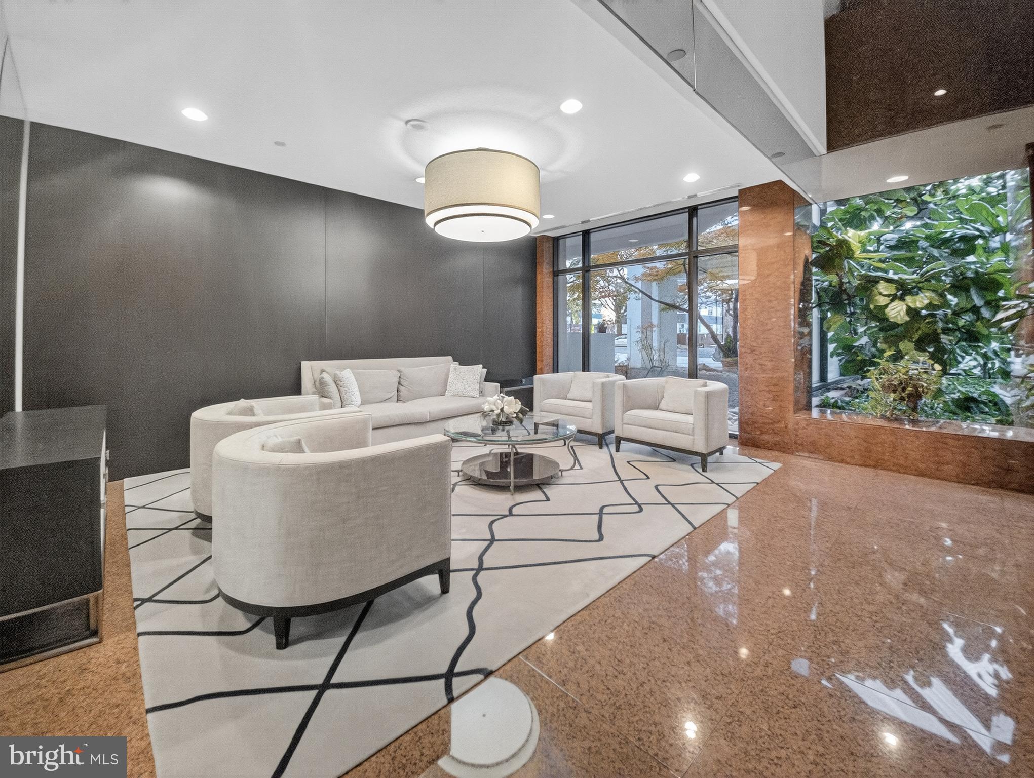 1530 Key Boulevard, Unit 517 Arlington, VA 22209 - Photo 40 of 50 a living room with furniture and a large window