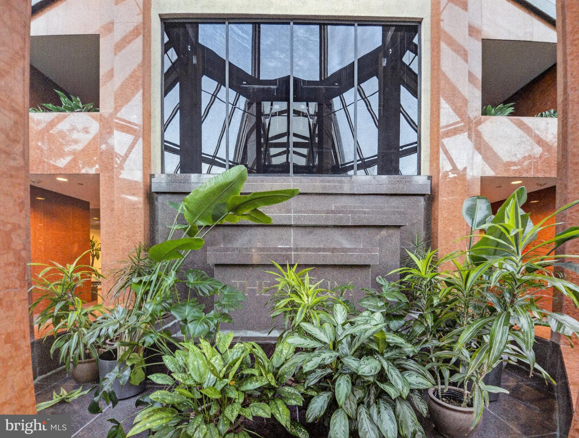 1530 Key Boulevard, Unit 517 Arlington, VA 22209 - Photo 42 of 50 a view of a house with a flower garden