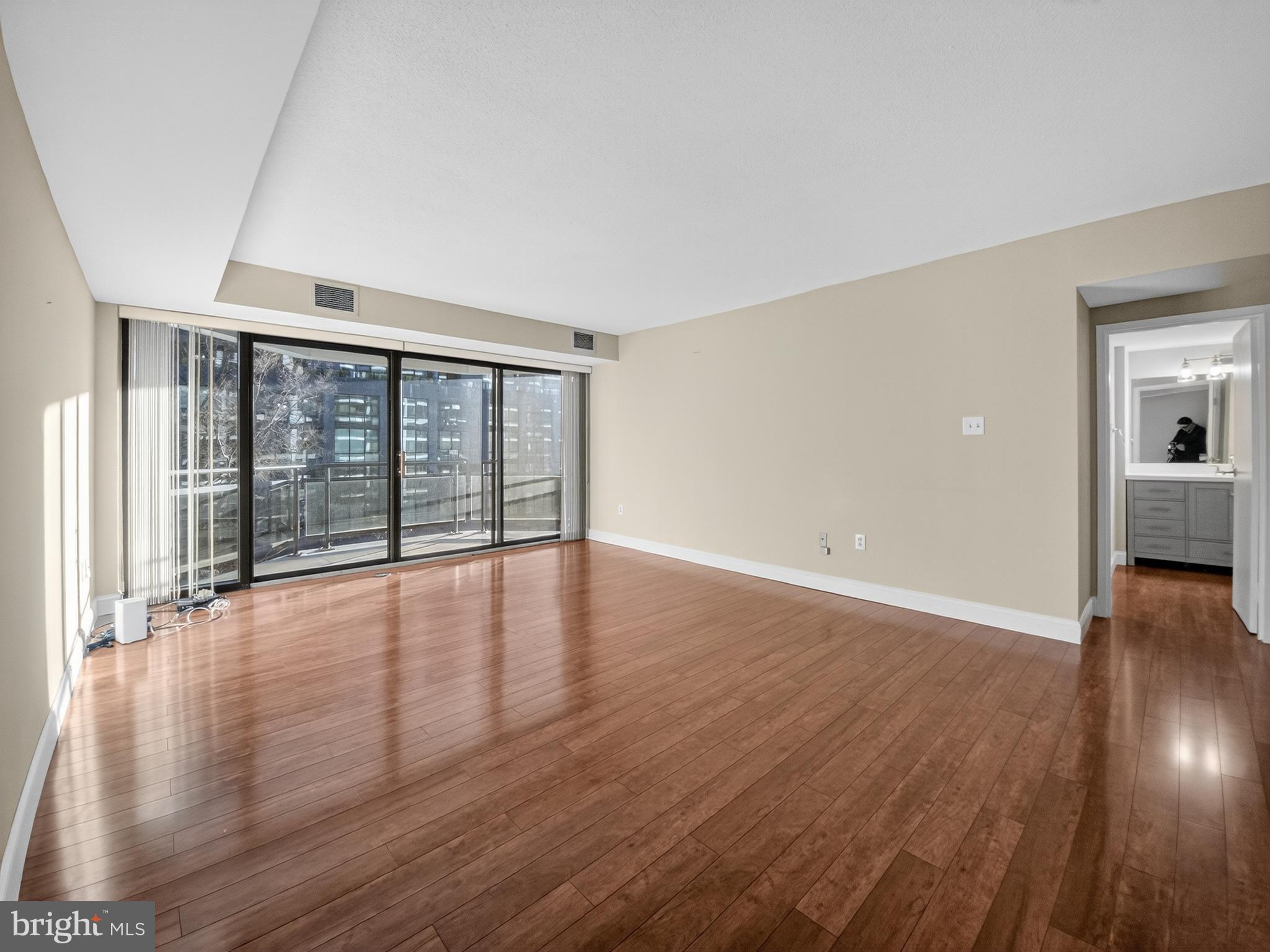 1530 Key Boulevard, Unit 517 Arlington, VA 22209 - Photo 9 of 50 wooden floor in an empty room with a window
