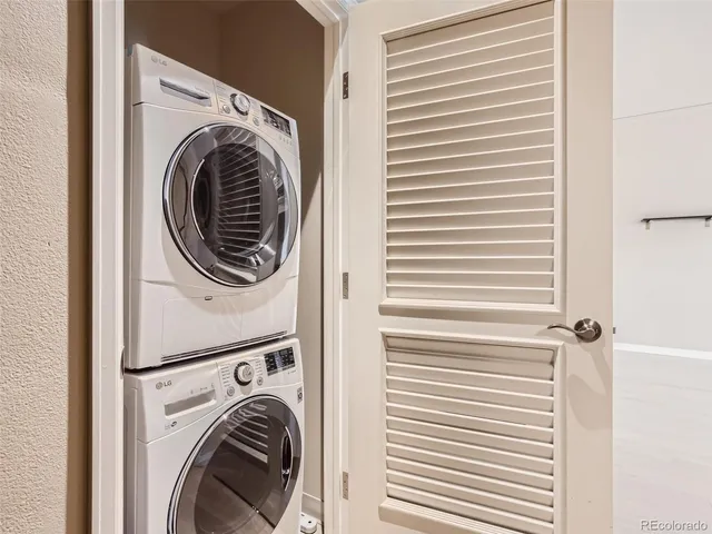 a view of a hallway with washer and dryer