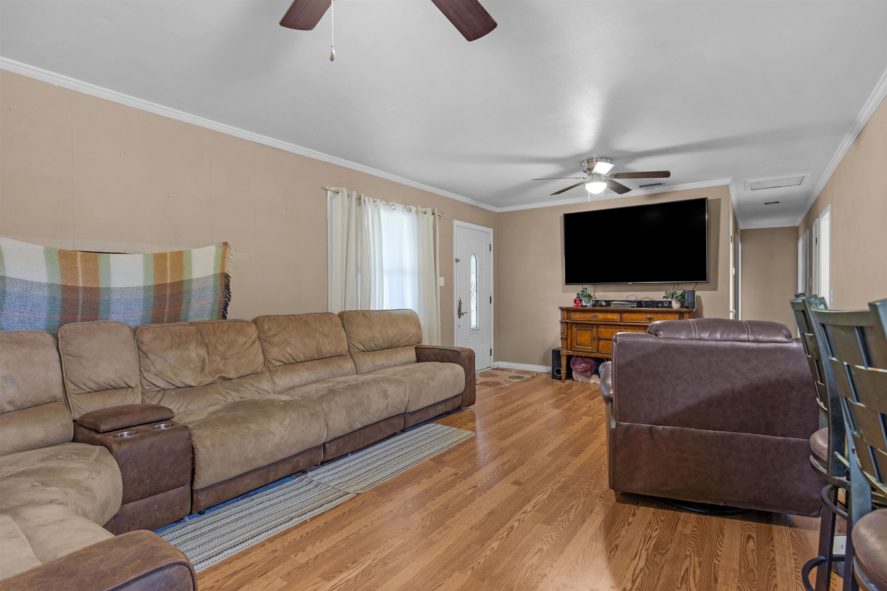 1147 Mack Pond Road Atmore, AL 36502 - Photo 8 of 40 Living room featuring light wood-type flooring, ceiling fan, and plenty of natural light