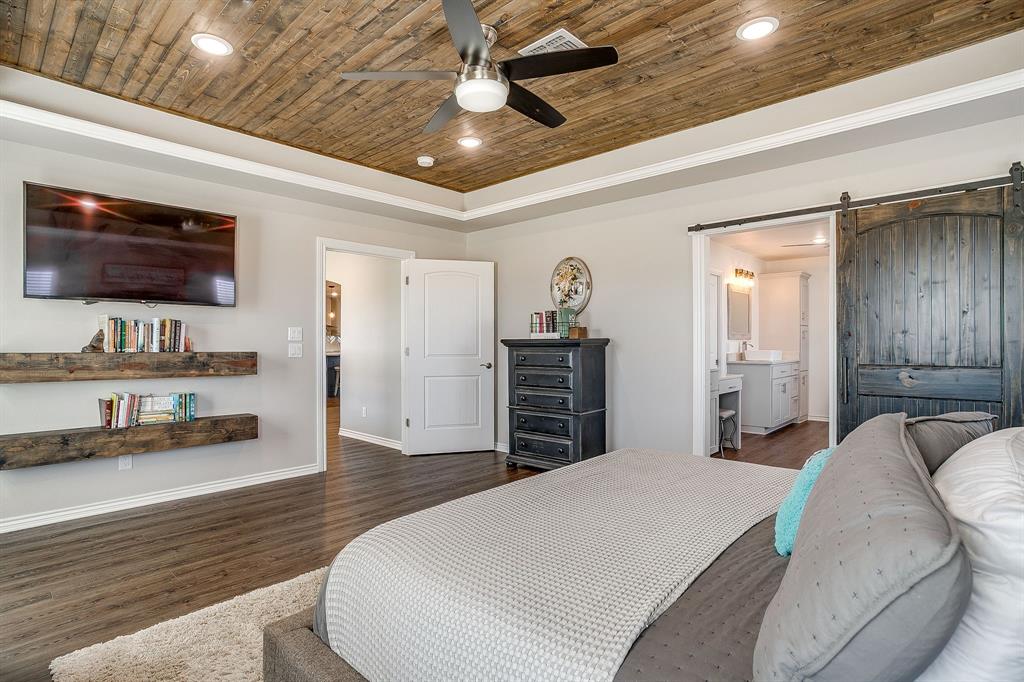 733 Fm 2652 Graham, TX 76450 - Photo 14 of 40 a bed room with a bed window and a television