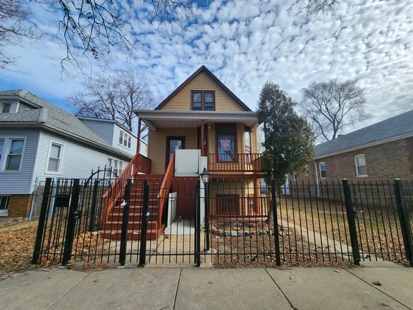 a front view of a house with glass windows