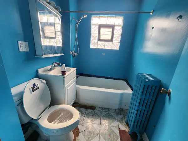 a bathroom with a sink toilet and bathtub