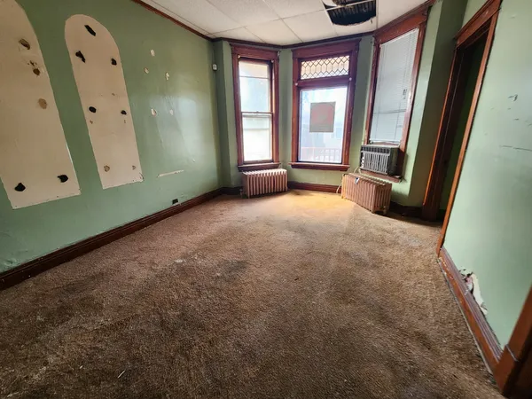 a view of a room with a large window