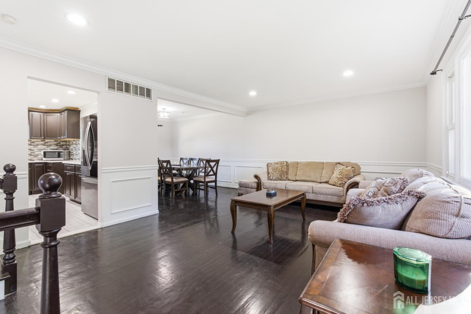 5 McKinley Street Edison, NJ 08820 - Photo 7 of 38 a living room with furniture and wooden floor