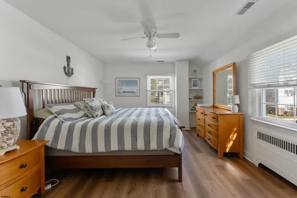 a bed room with a bed and a window