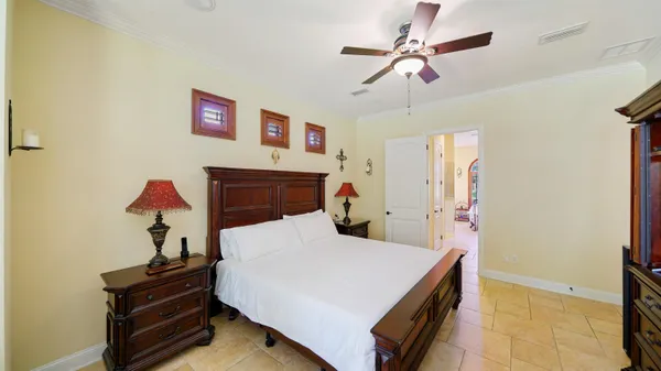 a view of a workspace room with furniture and front door