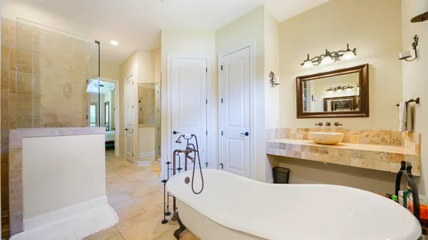 a living room with furniture a table and a large window