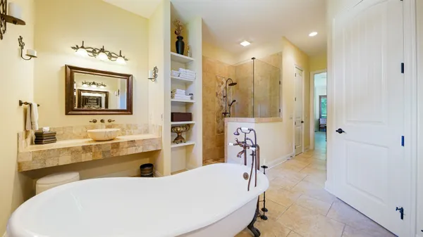 a view of a patio with a table and chairs