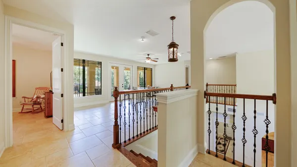 a bedroom with a bed and a chair