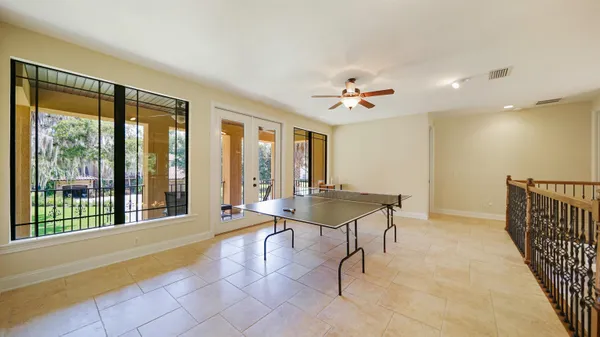 a view of a hallway and a livingroom with furniture