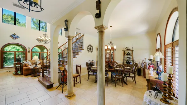 a view of an entryway with wooden floor