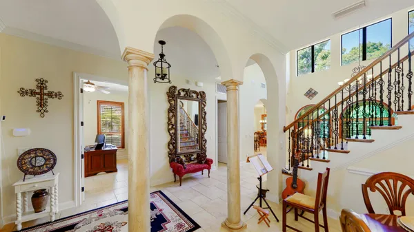 a living room with furniture and a large window