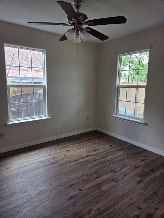 2532 Milo Street Corpus Christi, TX 78415 - Photo 6 of 7 wooden floor in an empty room with a window