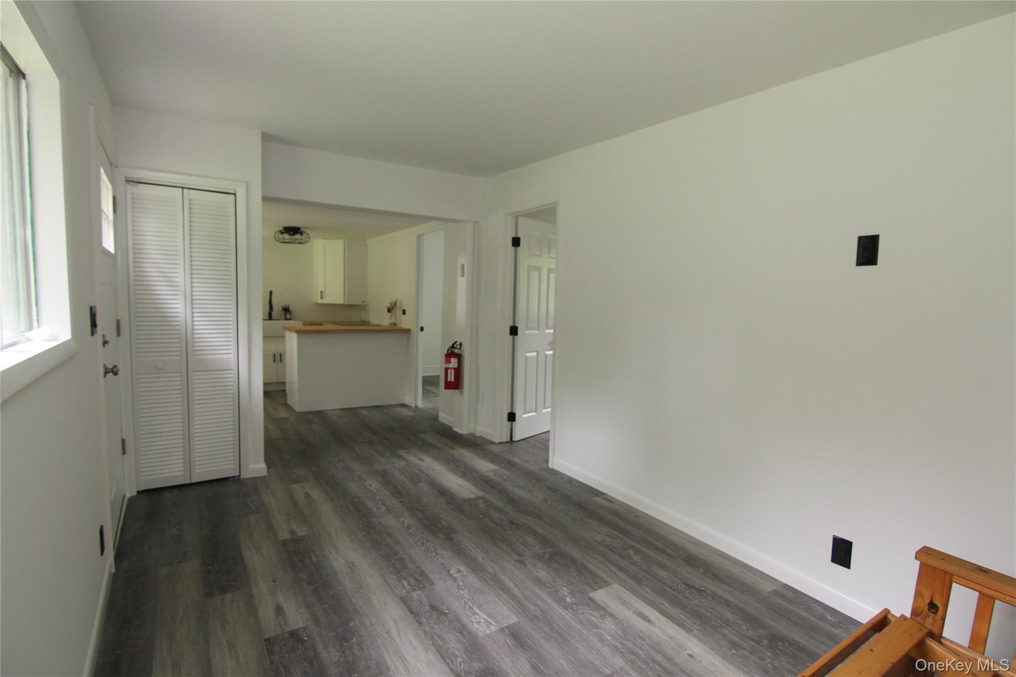 191 Sylvan Lake Road, Unit 1 Hopewell Junction, NY 12533 - Photo 11 of 36 a view of a kitchen from the hallway