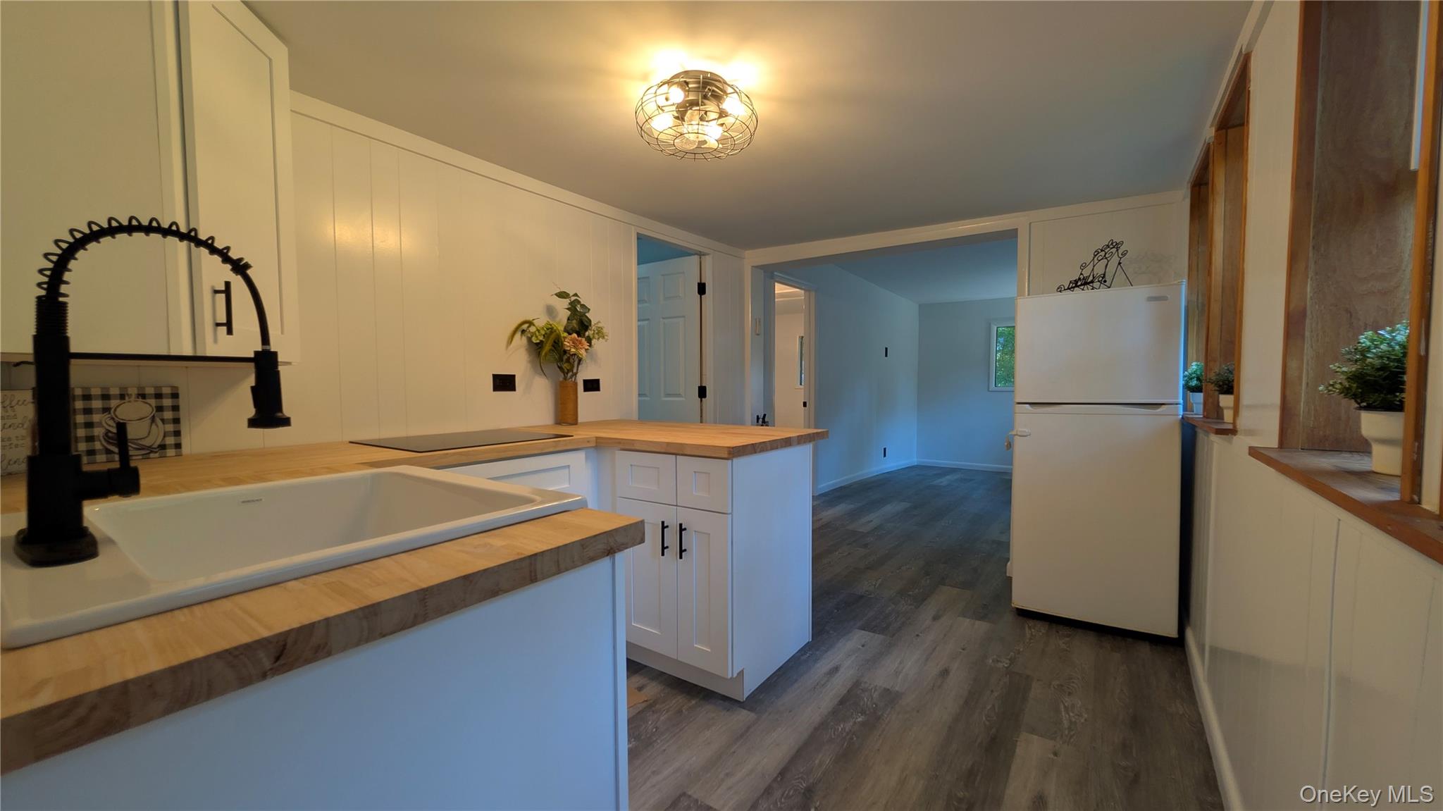 191 Sylvan Lake Road, Unit 1 Hopewell Junction, NY 12533 - Photo 13 of 36 a kitchen with a refrigerator and a stove