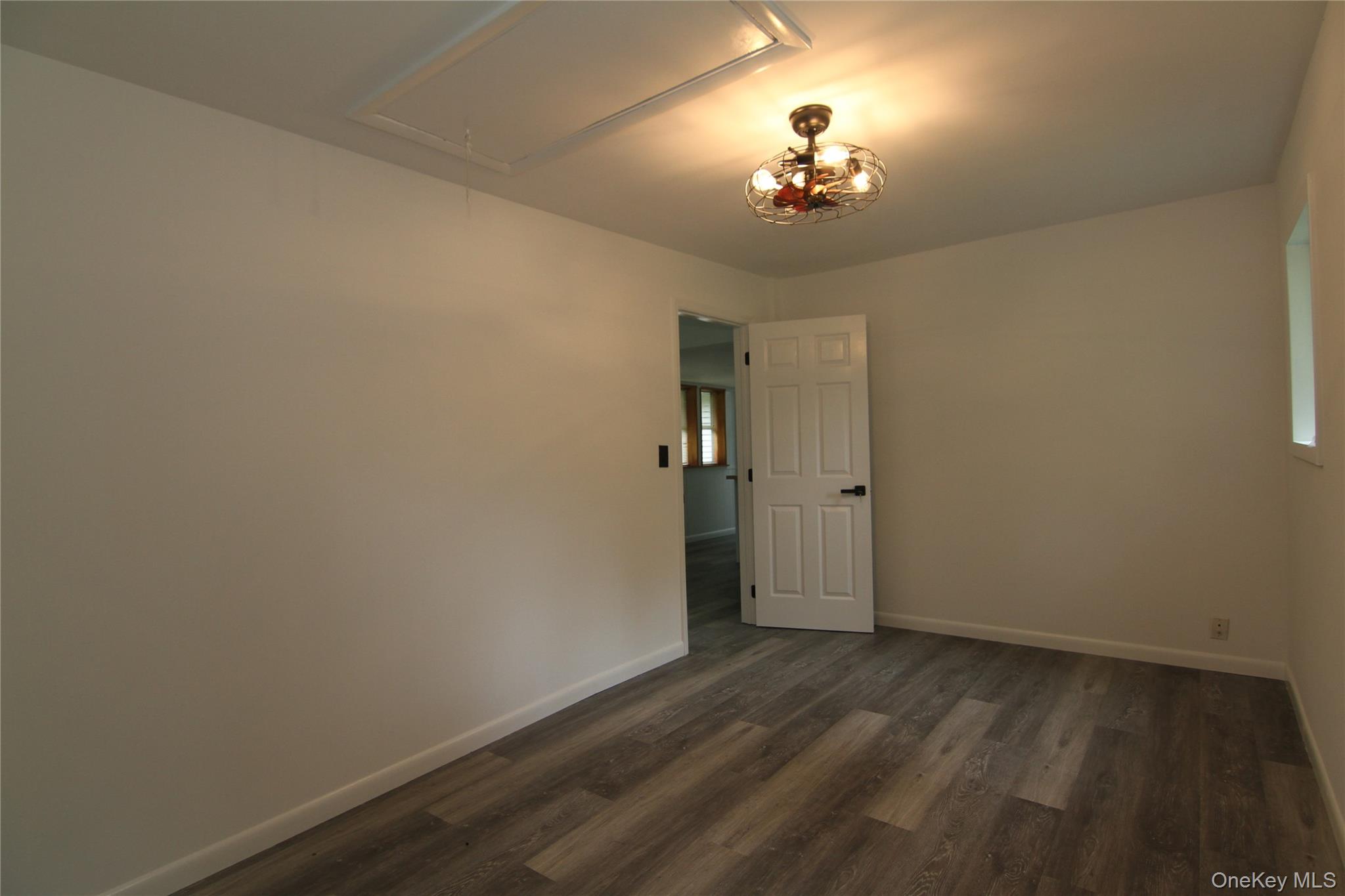 191 Sylvan Lake Road, Unit 1 Hopewell Junction, NY 12533 - Photo 21 of 36 a view of a chandelier in big room