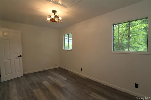 a bathroom with a sink vanity mirror and shower