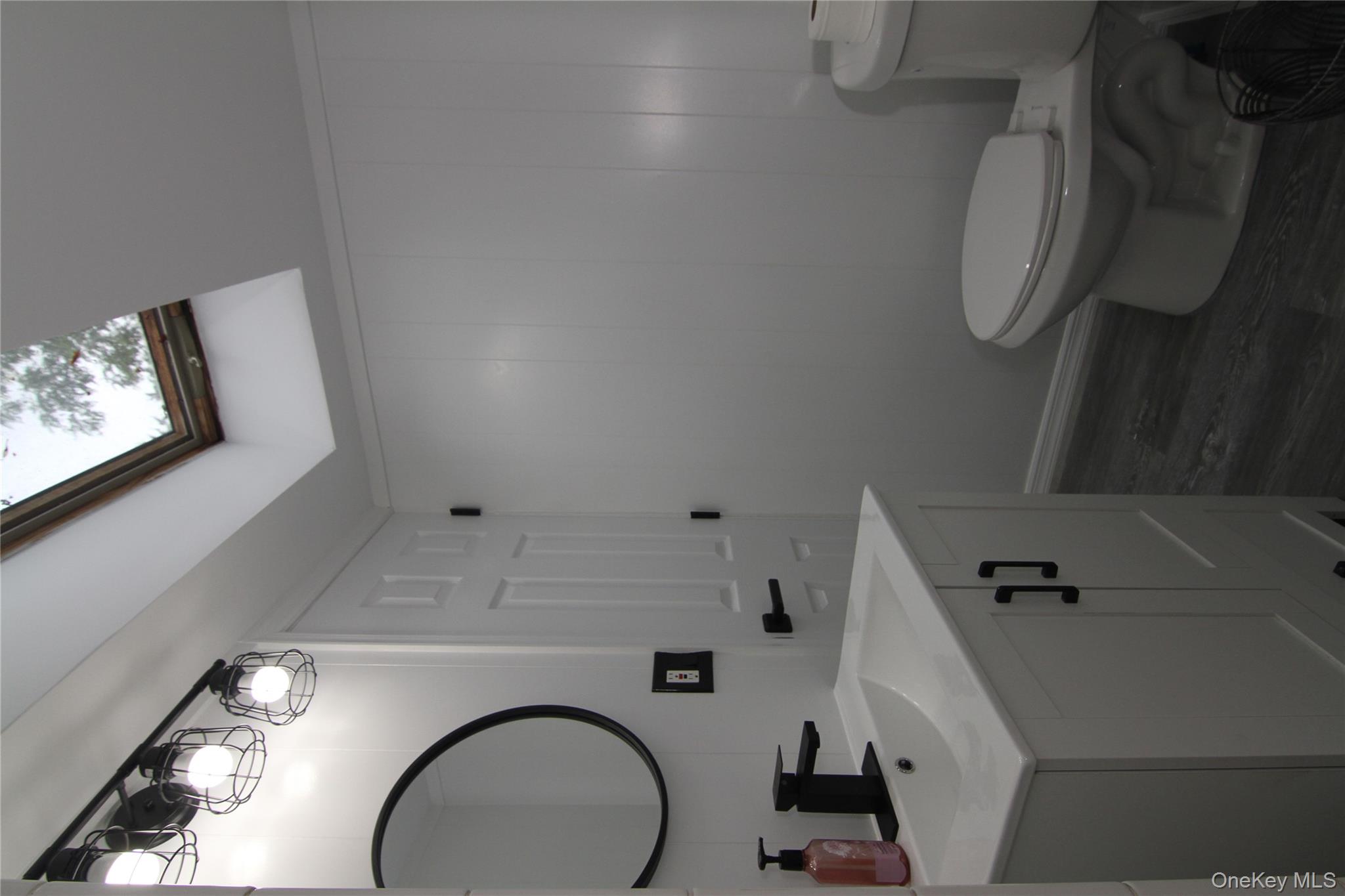 191 Sylvan Lake Road, Unit 1 Hopewell Junction, NY 12533 - Photo 24 of 36 a bathroom with a toilet sink and mirror