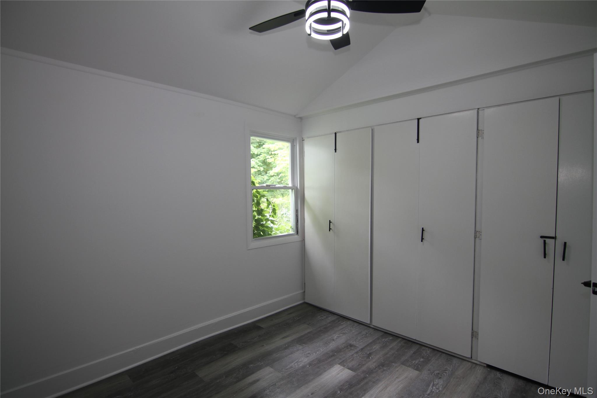 191 Sylvan Lake Road, Unit 1 Hopewell Junction, NY 12533 - Photo 27 of 36 a view of an empty room with a window