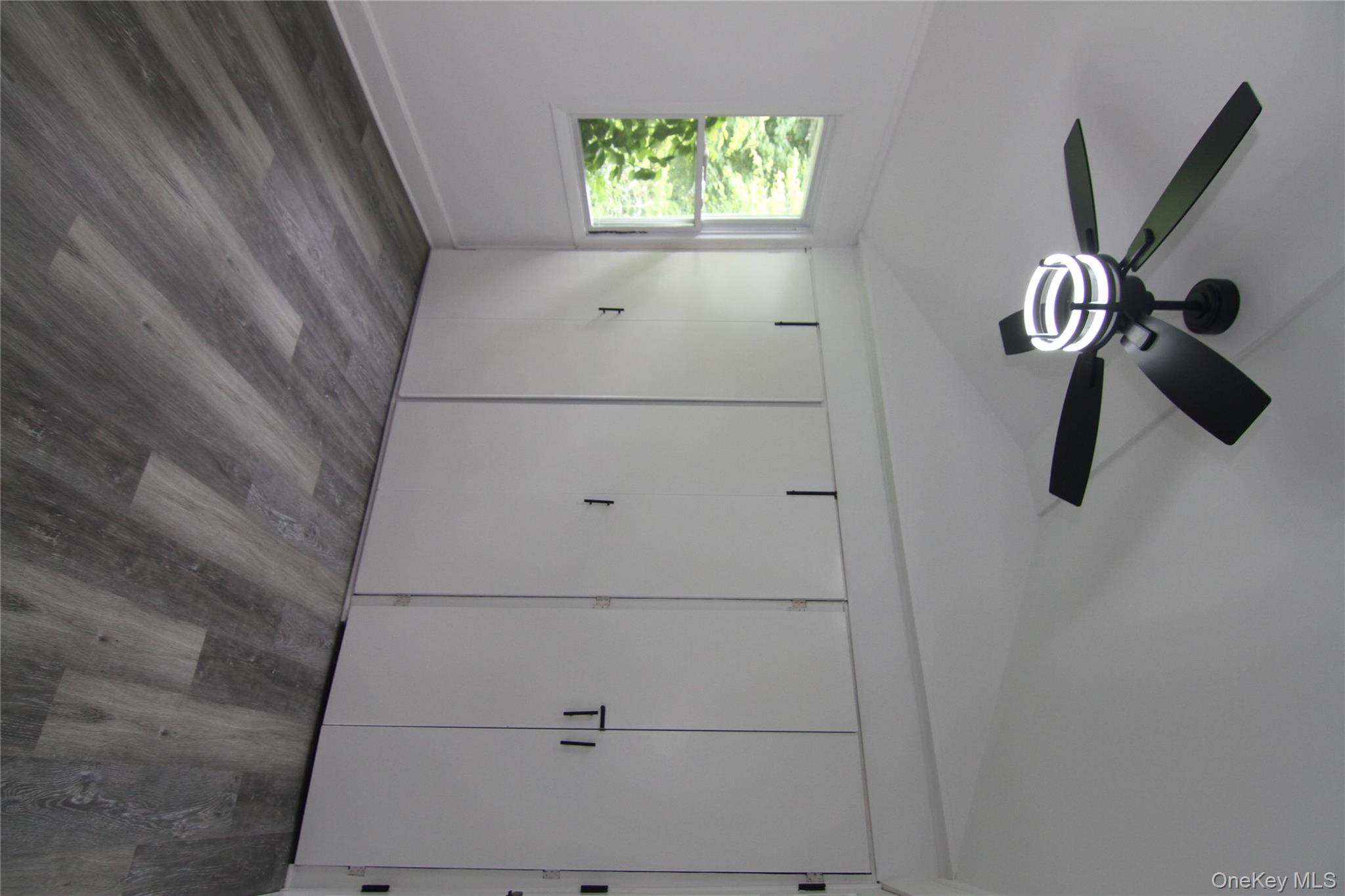 191 Sylvan Lake Road, Unit 1 Hopewell Junction, NY 12533 - Photo 29 of 36 a view of a livingroom with a fan