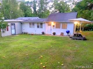 191 Sylvan Lake Road, Unit 1 Hopewell Junction, NY 12533 - Photo 3 of 36 a front view of a house with a garden