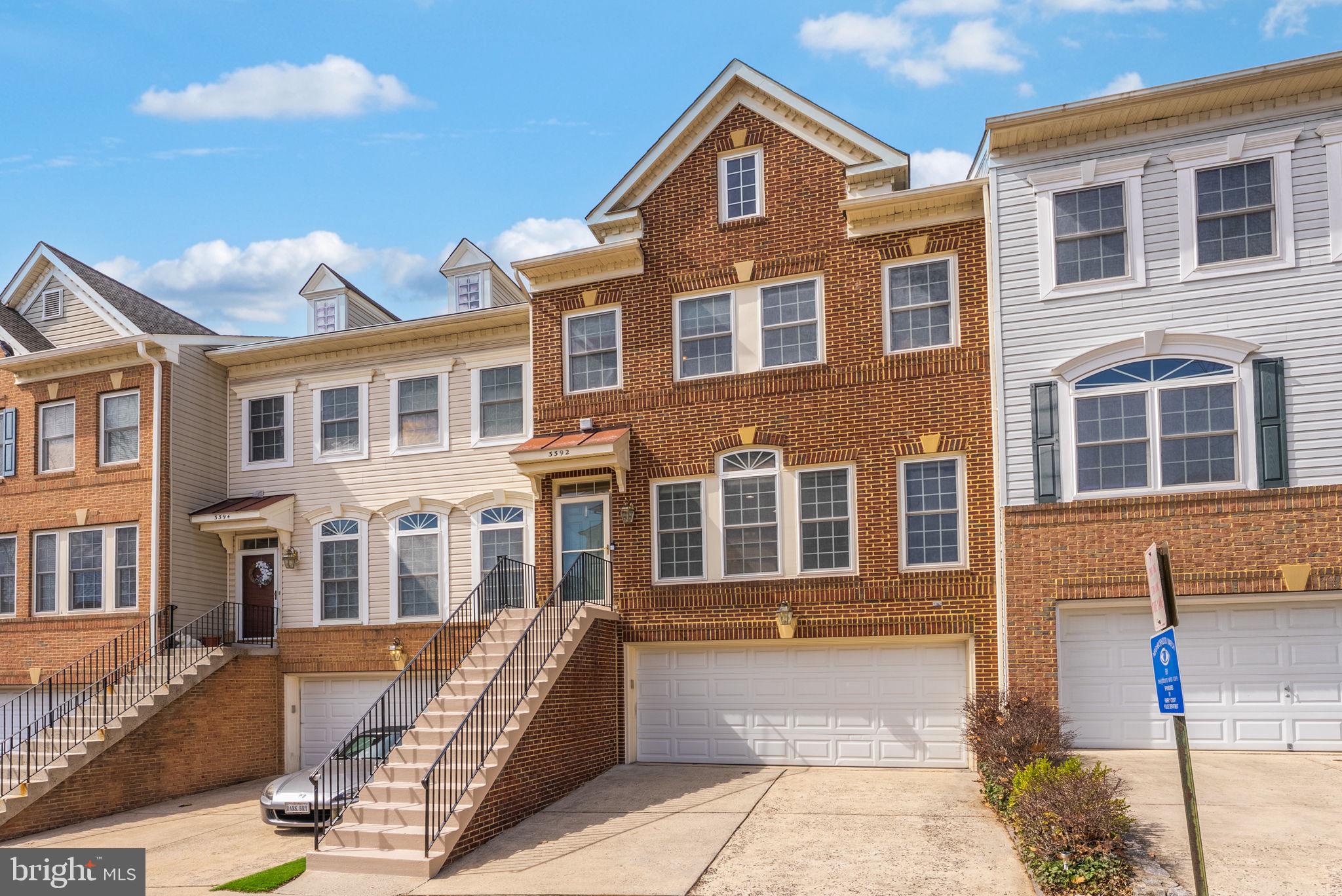 a front view of a building with many windows