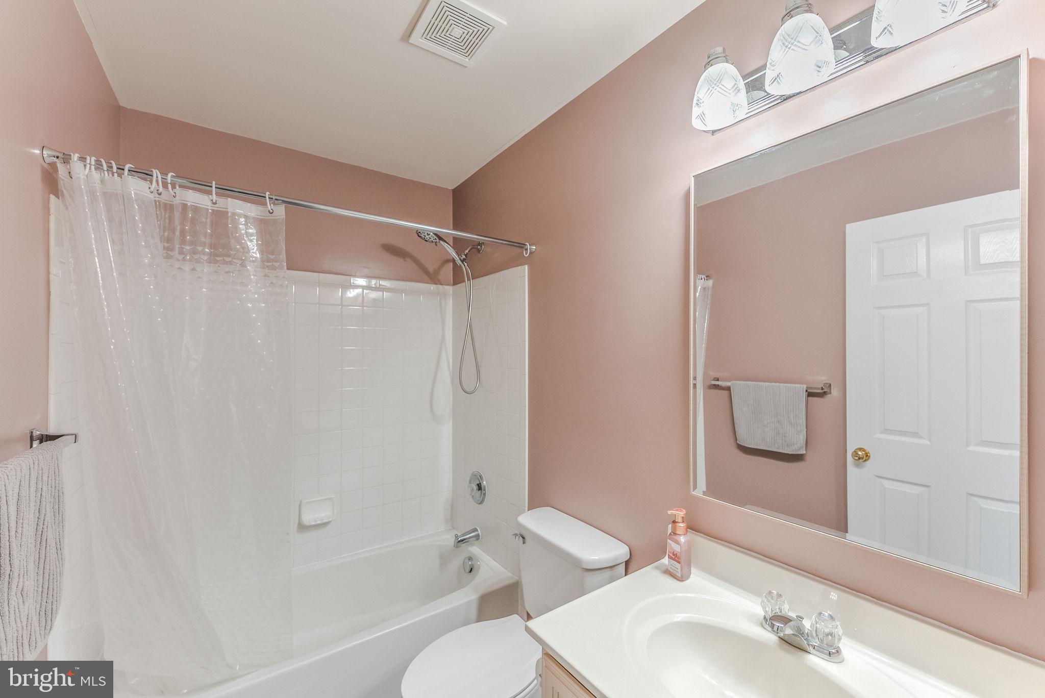 3392 Beechcliff Drive Alexandria, VA 22306 - Photo 19 of 25 a bathroom with a sink a toilet and shower