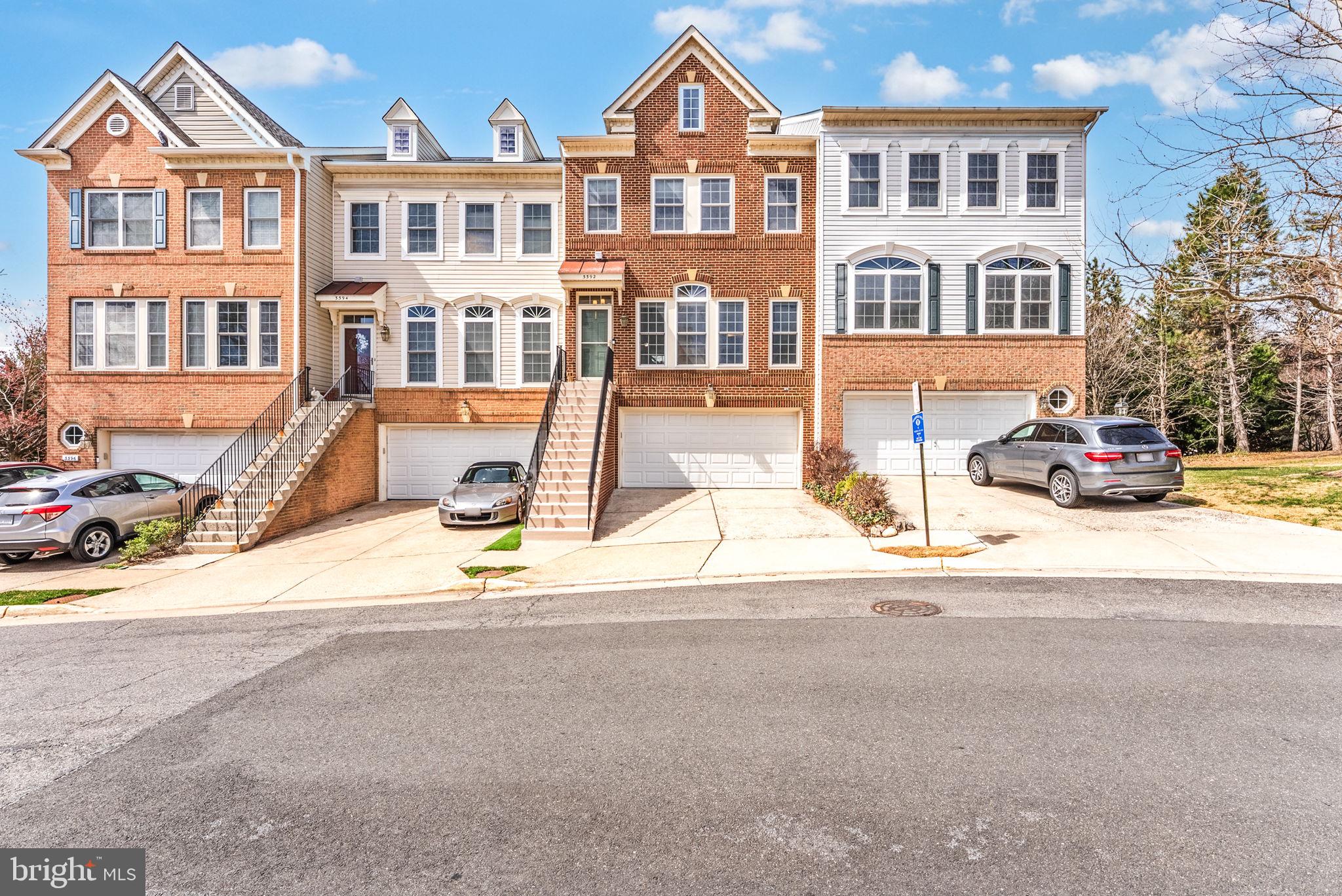 3392 Beechcliff Drive Alexandria, VA 22306 - Photo 2 of 25 a front view of a residential apartment building with a street