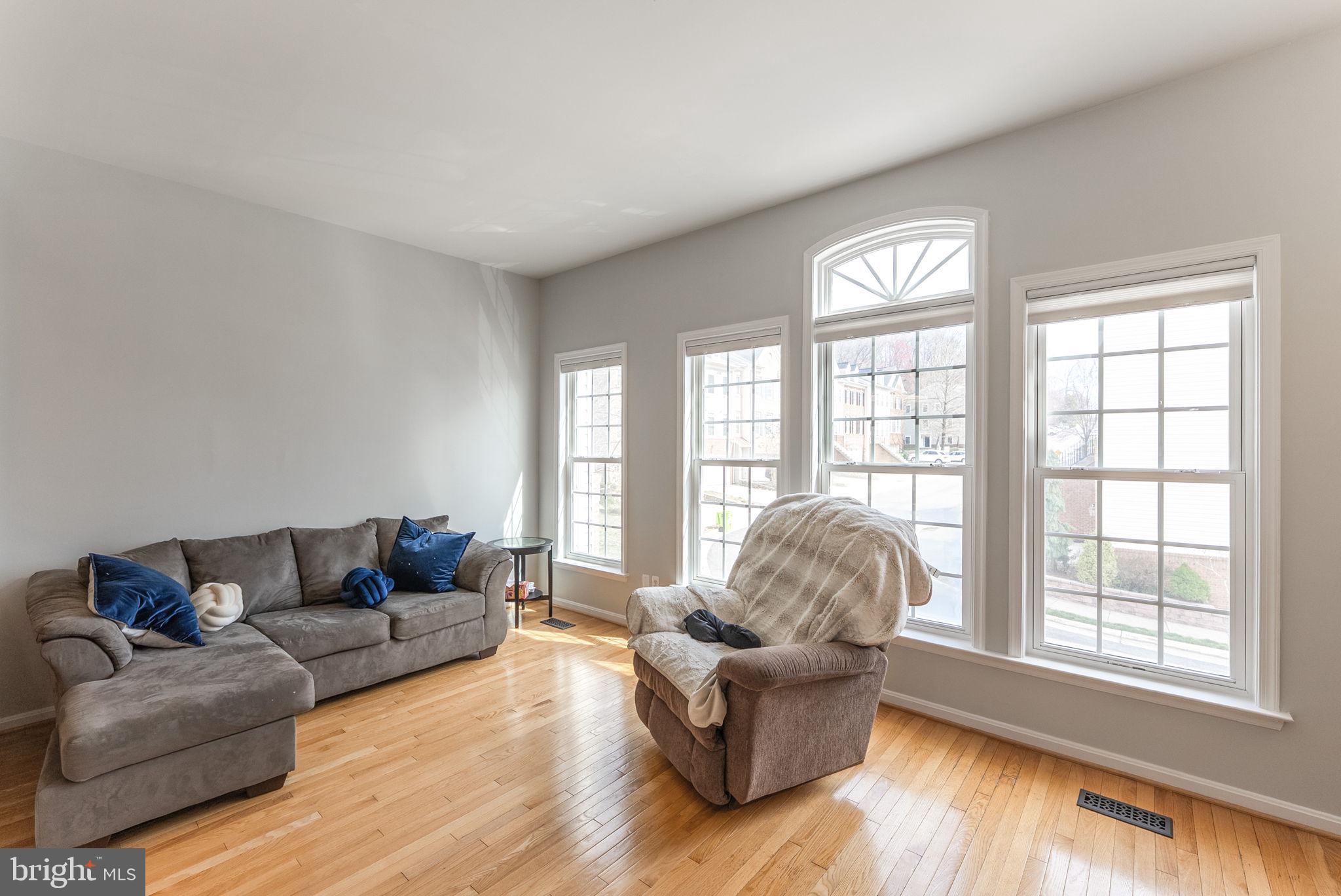 3392 Beechcliff Drive Alexandria, VA 22306 - Photo 5 of 25 a living room with furniture and a large window