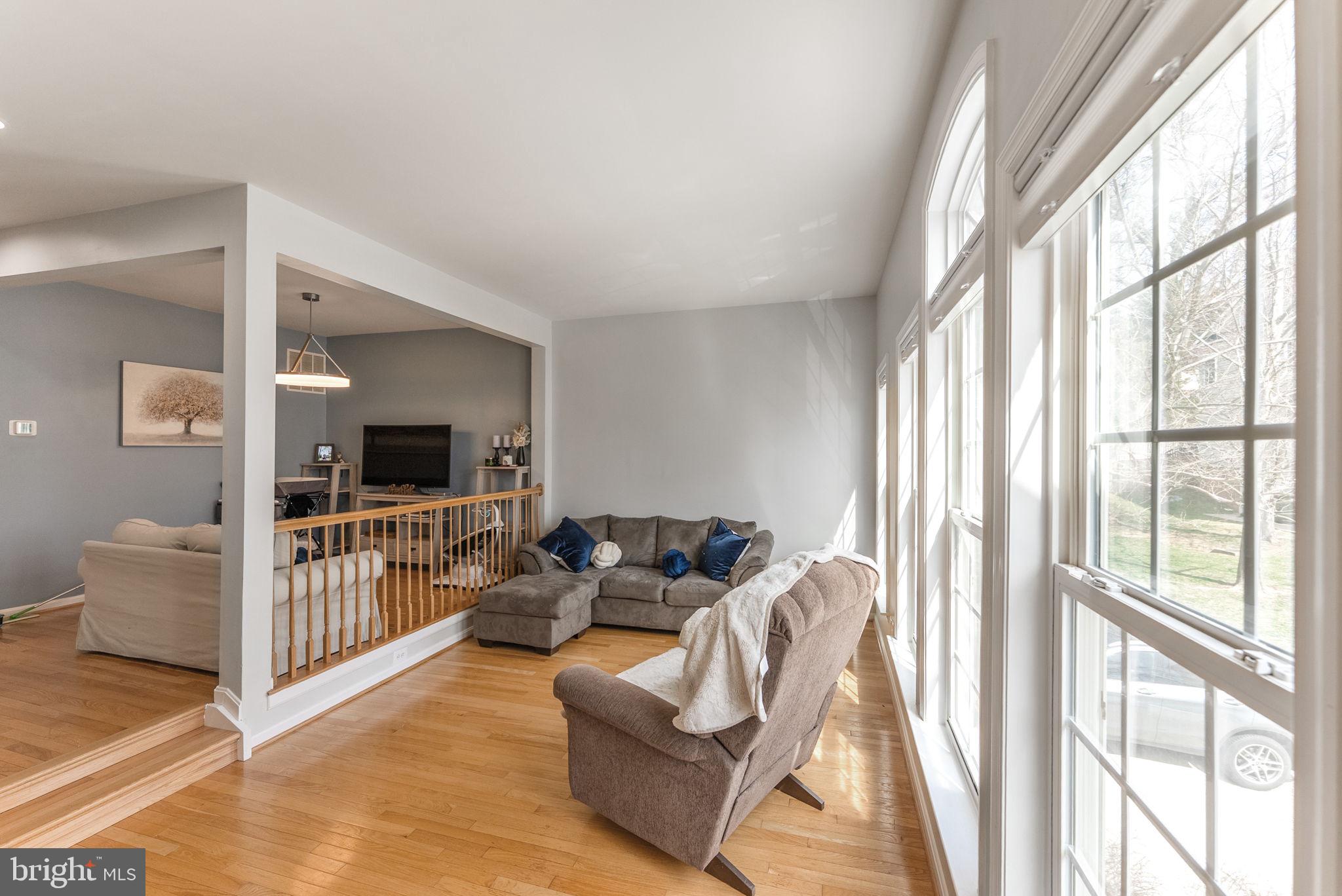 3392 Beechcliff Drive Alexandria, VA 22306 - Photo 6 of 25 a living room with furniture and a flat screen tv