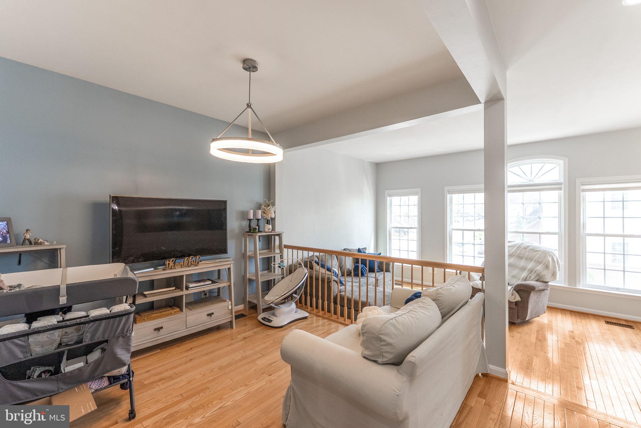 3392 Beechcliff Drive Alexandria, VA 22306 - Photo 7 of 25 a living room with furniture and a flat screen tv