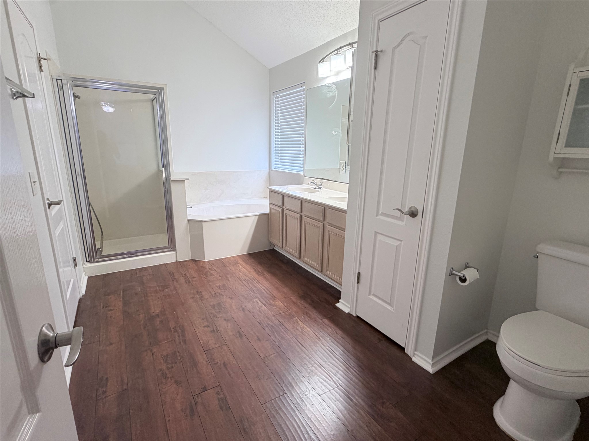 20809 Pacers Gait Lane Pflugerville, TX 78660 - Photo 13 of 23 a bathroom with a sink a toilet a tub and shower